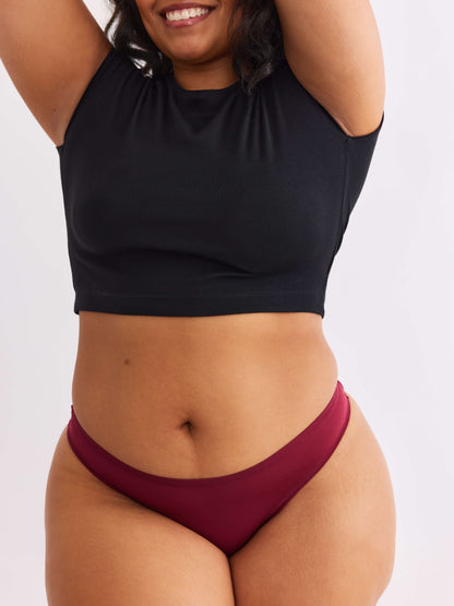 model A wearing merlot red pair of sustainable non-toxic women's underwear  front view 